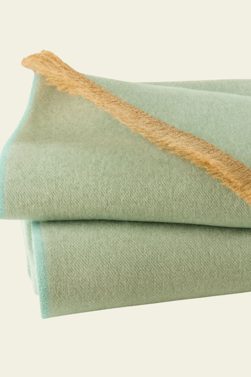 Luxury premium baby alpaca blanket Warmisqa in pastel green, made in Peru by Munay